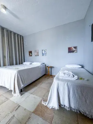 Uma cama ou camas num quarto em Pousada Mahalo Preá Beach