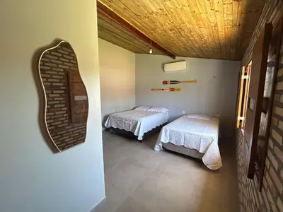 Uma cama ou camas num quarto em Chalé das Dunas Guajiru