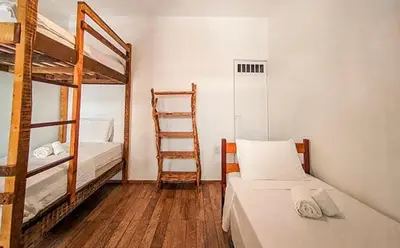 Uma cama ou camas num quarto em Che Brazil Pousada