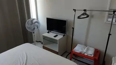 Uma televisão e/ou sistema de entretenimento em Apartamento na Beira Mar de Fortaleza
