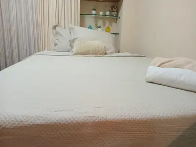 Uma cama ou camas num quarto em Ed Scala Residenza na Beira-mar em Fortaleza