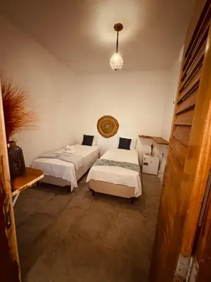 Uma cama ou camas num quarto em Lu Pousada Charme Preá