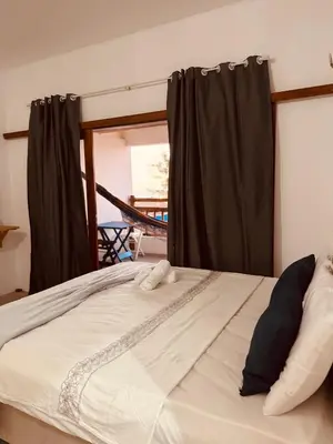 Uma cama ou camas num quarto em Lu Pousada Charme Preá