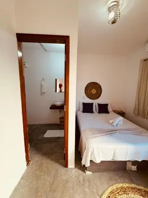 Uma cama ou camas num quarto em Lu Pousada Charme Preá