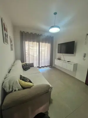 Uma televisão e/ou sistema de entretenimento em Boas Vistas Condominium Cobertura