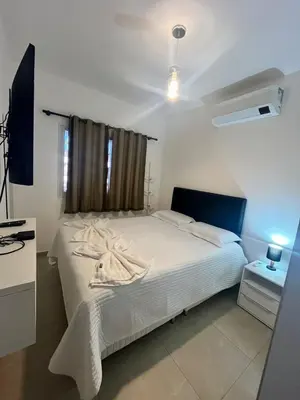 Uma cama ou camas num quarto em Boas Vistas Condominium Cobertura