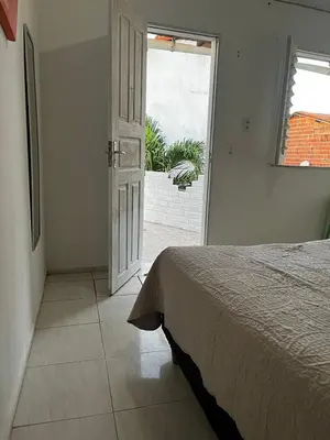 Uma cama ou camas num quarto em Recanto canoa da costureira Fran