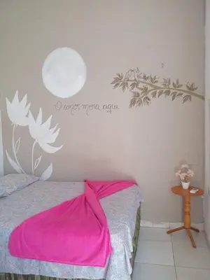 Uma cama ou camas num quarto em Recanto canoa da costureira Fran