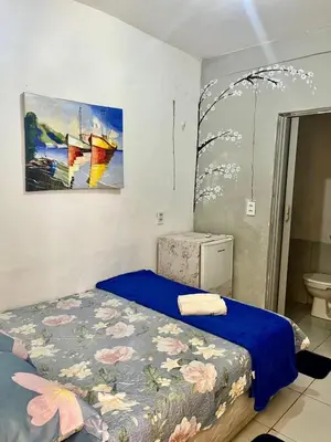 Uma cama ou camas num quarto em Recanto canoa da costureira Fran