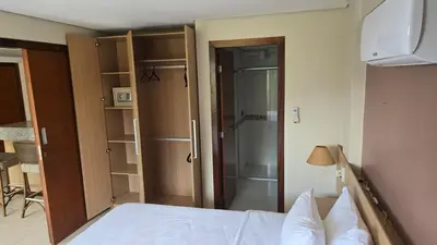 Uma cama ou camas num quarto em Beachfront Ap 314 Kariri Beach