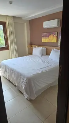 Uma cama ou camas num quarto em Beachfront Ap 314 Kariri Beach