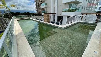 A piscina em ou perto de Ap próx ao shopping com garagem, piscina e ar