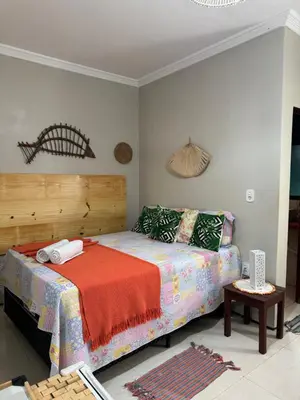 Uma cama ou camas num quarto em Pousada Delicias da vila