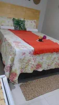 Uma cama ou camas num quarto em Pousada Delicias da vila