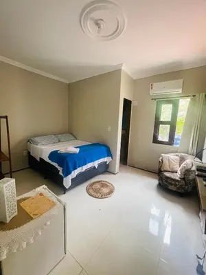 Uma cama ou camas num quarto em Pousada Delicias da vila
