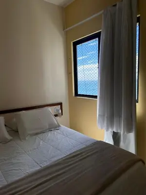 Uma cama ou camas num quarto em Av. Beira Mar - Flat com Localização Perfeita