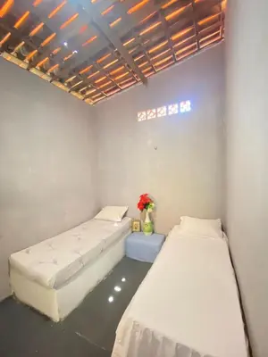 Uma cama ou camas num quarto em Martins