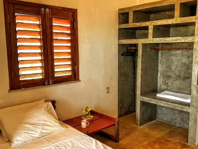 Uma cama ou camas num quarto em Casa Tartaruga Emboaca Trairí