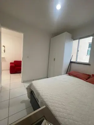 Uma cama ou camas num quarto em Ipê Street Hostel