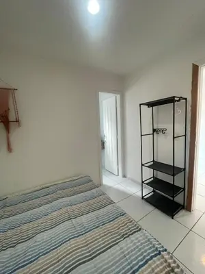 Uma cama ou camas num quarto em Ipê Street Hostel