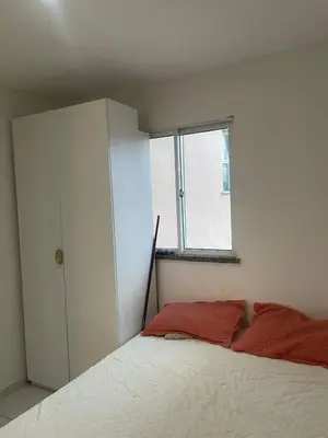 Uma cama ou camas num quarto em Ipê Street Hostel