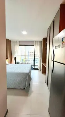 Uma cama ou camas num quarto em Acorde com o Sol de Fortaleza Studio Charmoso no Meireles