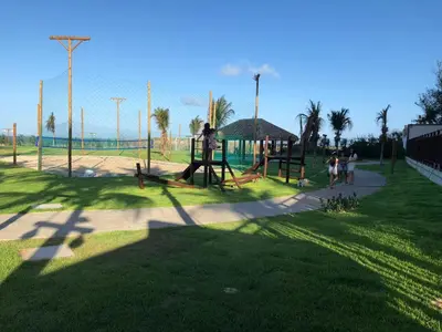 A área de jogos para crianças em Apartamento térreo nascente Beach Living