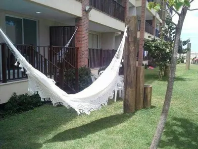 Um jardim no exterior de Apartamento térreo nascente Beach Living