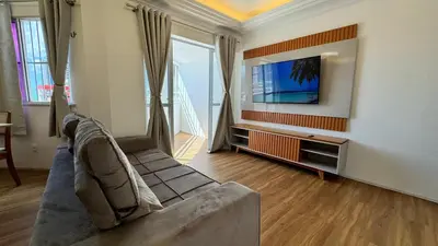 Uma televisão e/ou sistema de entretenimento em Amplo Apartamento com 3 Quartos em Fortaleza