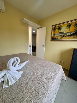 Uma cama ou camas num quarto em VG FUN 413 Praia Futuro Vista Mar Pé na Areia 2 quartos 2 wcs Imob Temporada