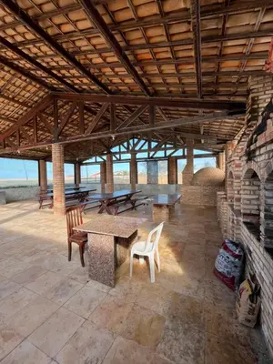 Uma varanda ou terraço em Pousada frente mar
