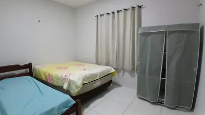 Uma cama ou camas num quarto em Casa Praia Paracuru
