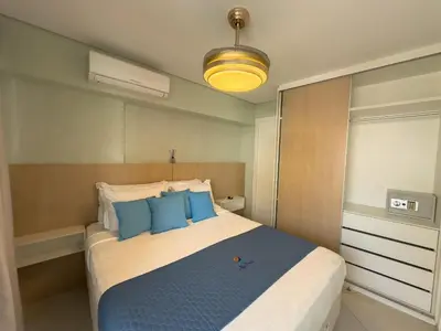 Uma cama ou camas num quarto em Studio Landscape Meireles Fortaleza