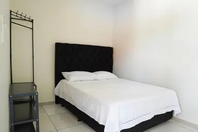 Uma cama ou camas num quarto em Bendita Parada - Pousada