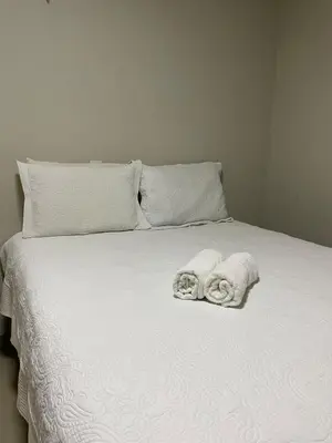 Uma cama ou camas num quarto em flat paraíso jeri