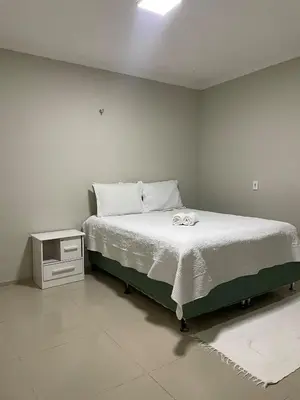 Uma cama ou camas num quarto em flat paraíso jeri