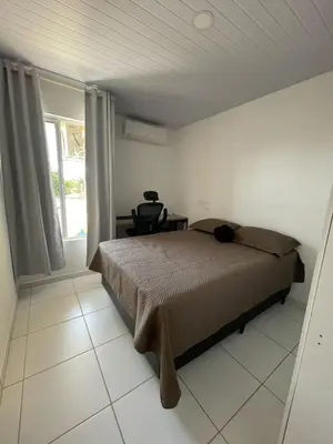 Uma cama ou camas num quarto em Apartamento Dunnas