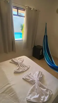Uma cama ou camas num quarto em Pousada Marazul