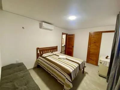 Uma cama ou camas num quarto em Casa Alvorada