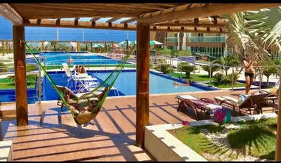 A piscina em ou perto de Apt p 7 pessoas pé na areia com vista Mar