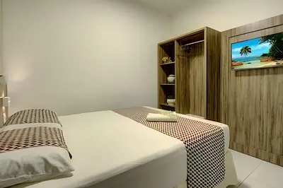 Uma cama ou camas num quarto em MansãoVistaMar-BEACH PARK-35Pessoas - HOUSINGCEARÁ