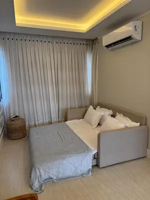 Uma cama ou camas num quarto em Flat Beira Mar Meireles