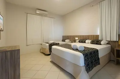 Uma cama ou camas num quarto em Mansão Luxo 32 Pessoas-BeachPARK - BY HousingCeara
