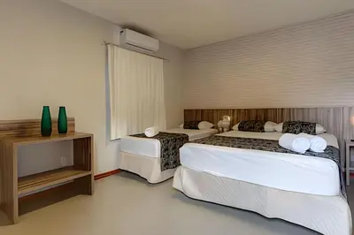 Uma cama ou camas num quarto em Mansão Luxo 32 Pessoas-BeachPARK - BY HousingCeara