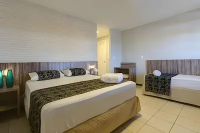 Uma cama ou camas num quarto em Mansão Luxo 32 Pessoas-BeachPARK - BY HousingCeara
