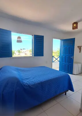 Uma cama ou camas num quarto em Pousada Brad Pitt