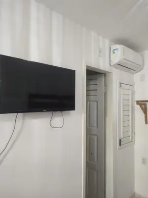 Uma televisão e/ou sistema de entretenimento em Pousada Brad Pitt