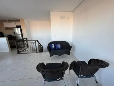 Uma área de estar em Cobertura Dunas Prime