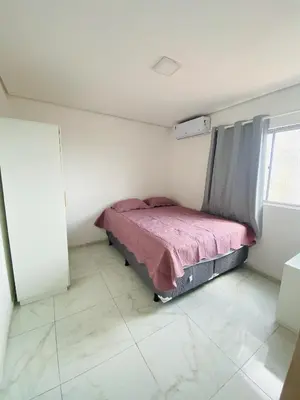 Uma cama ou camas num quarto em Apartamento compacto com vista pro Mar 401