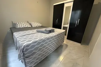 Uma cama ou camas num quarto em Completa Perfeita para Turismo de Negócios e Lazer por Will